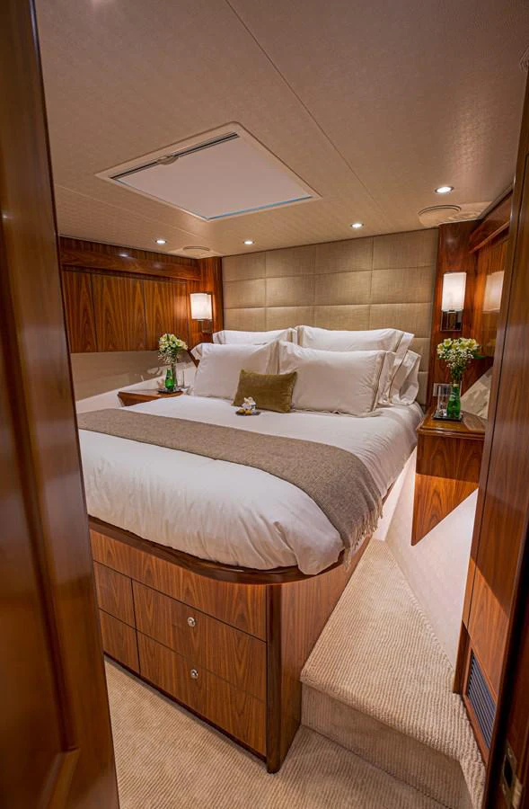 a large bed with white sheets aboard SPECULATOR Yacht for Sale