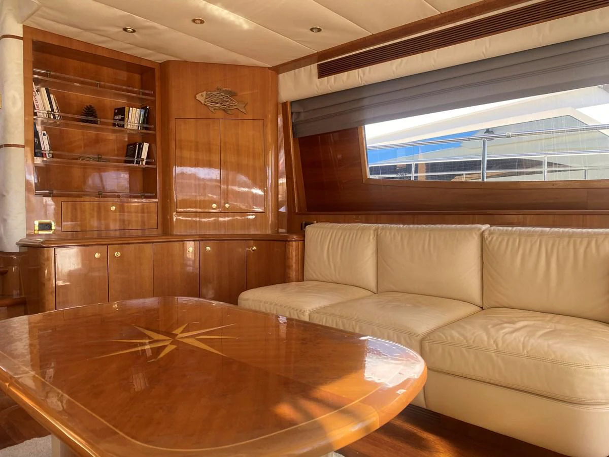 a living room with a table aboard AMADEUS Yacht for Sale