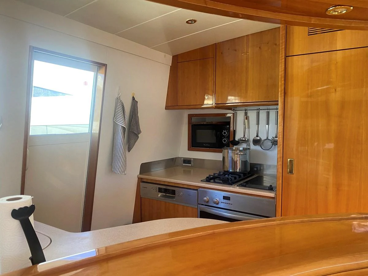 a kitchen with a window aboard AMADEUS Yacht for Sale
