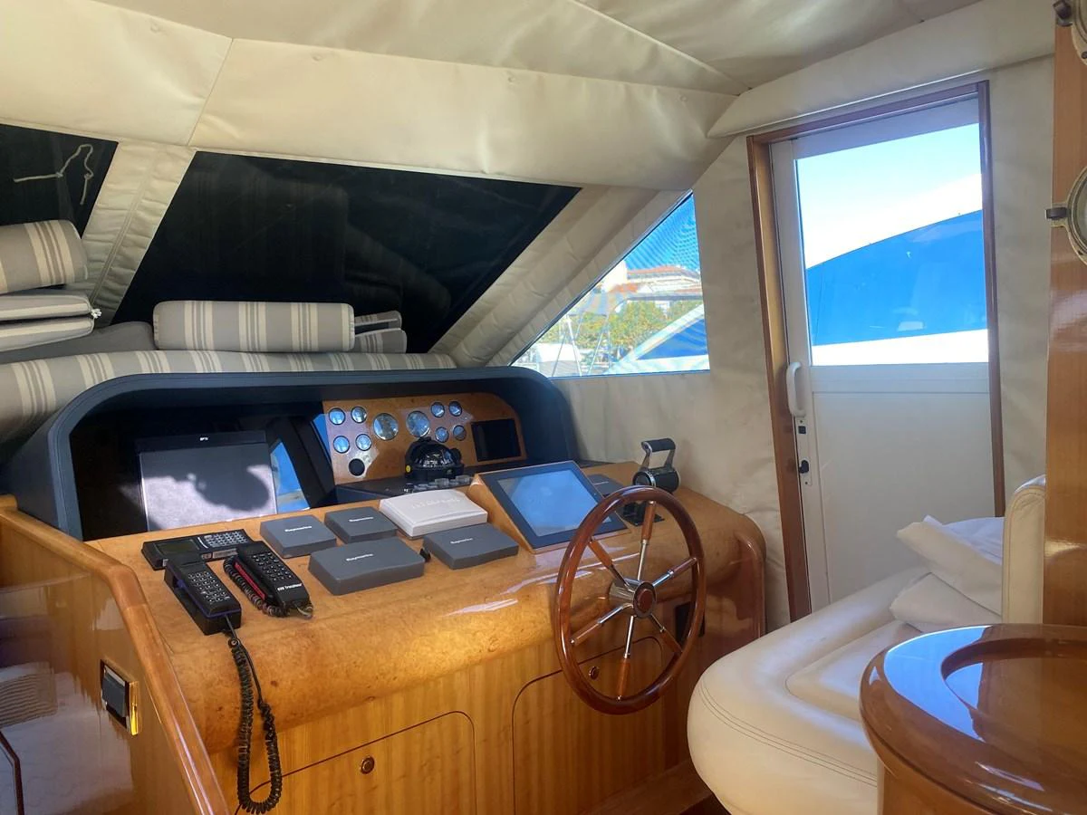a small airplane with a desk and a chair aboard AMADEUS Yacht for Sale