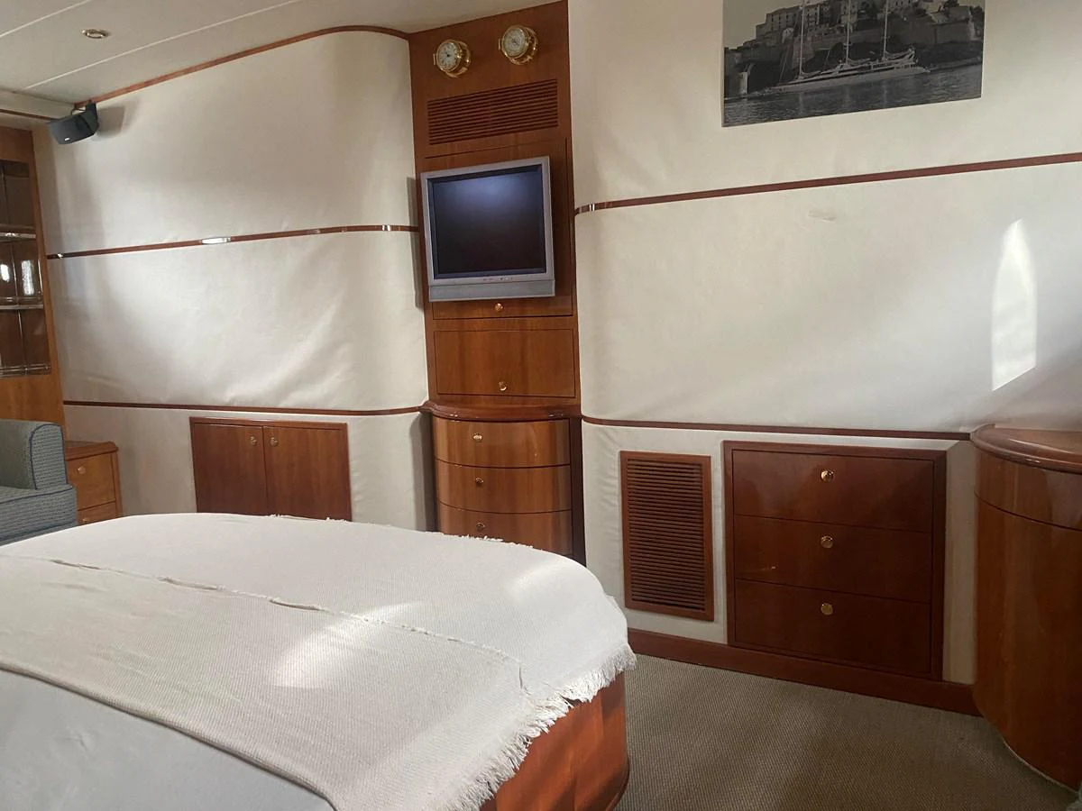 a bed in a room aboard AMADEUS Yacht for Sale