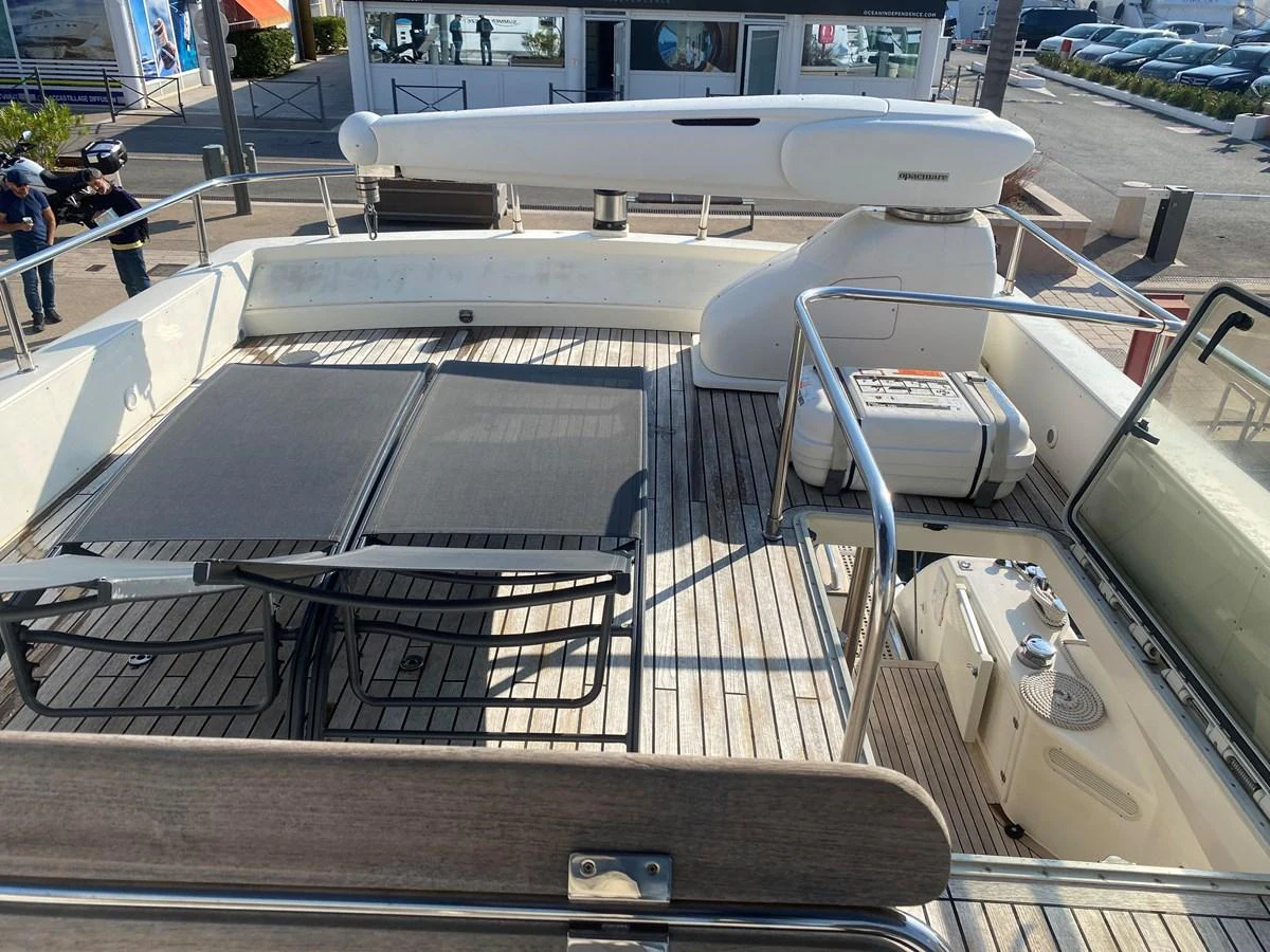 a silver car on display aboard AMADEUS Yacht for Sale