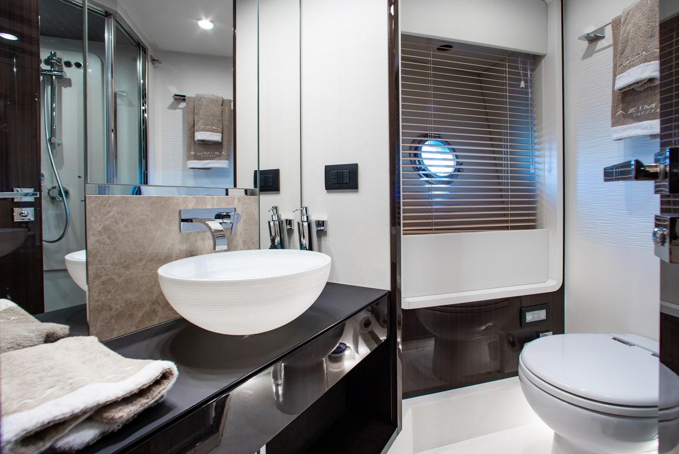 a bathroom with a large mirror aboard ROLLING LOUD Yacht for Sale