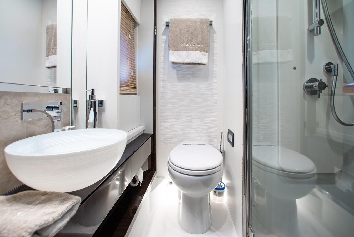 a bathroom with a sink toilet and shower aboard ROLLING LOUD Yacht for Sale