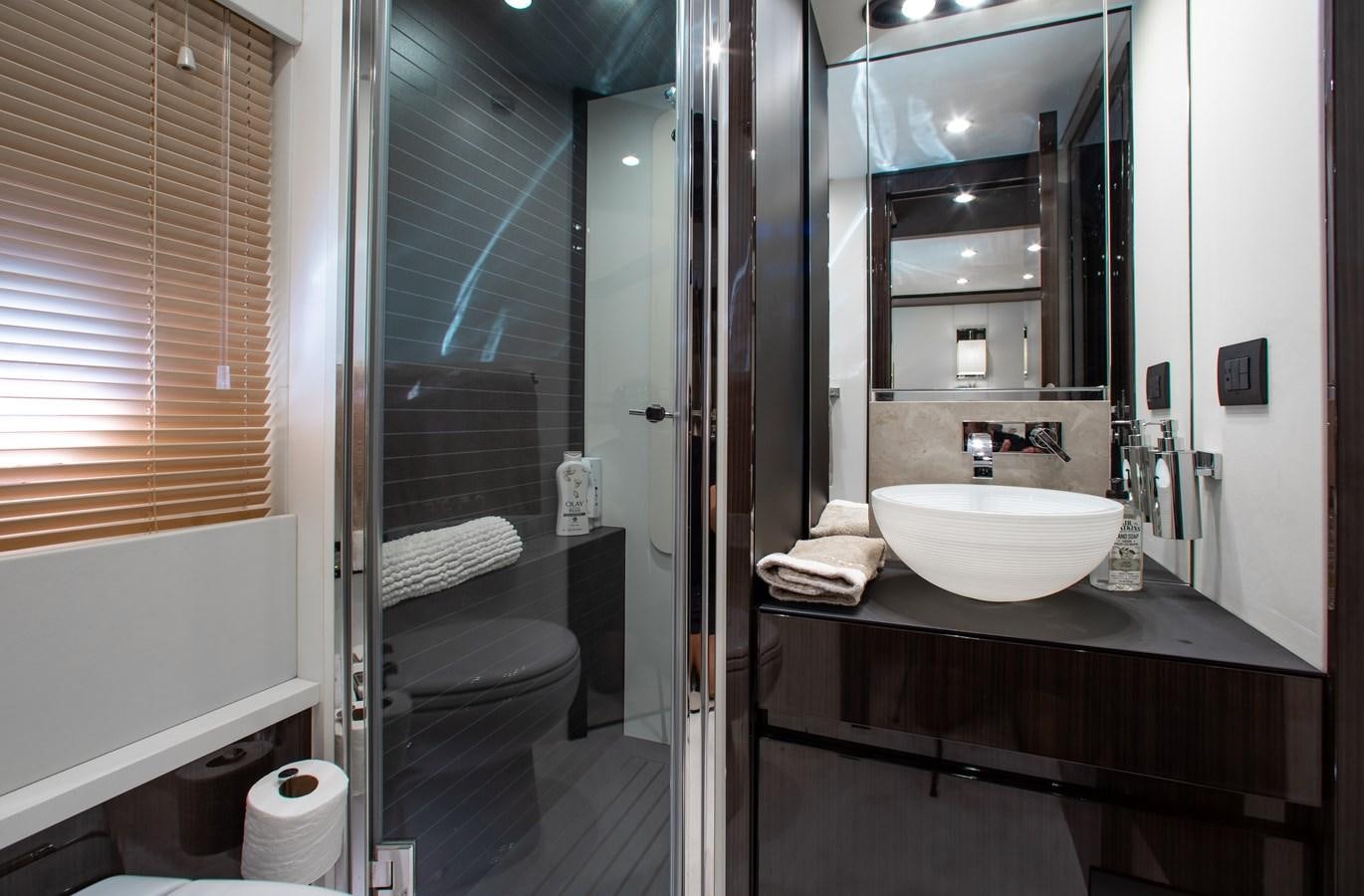 a bathroom with a sink and a mirror aboard ROLLING LOUD Yacht for Sale