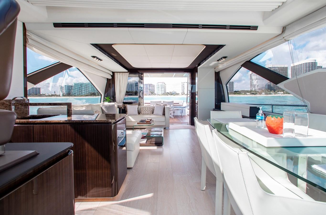 a room with a table and chairs aboard ROLLING LOUD Yacht for Sale