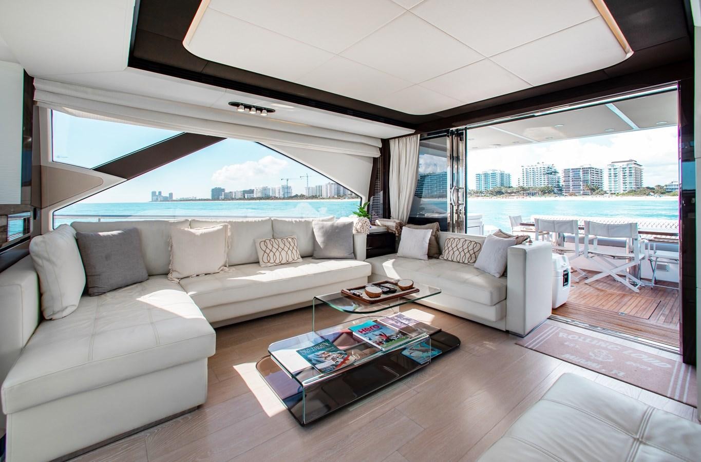 a living room with a large window aboard ROLLING LOUD Yacht for Sale