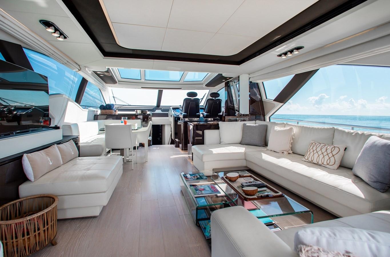 a living room with a large window aboard ROLLING LOUD Yacht for Sale