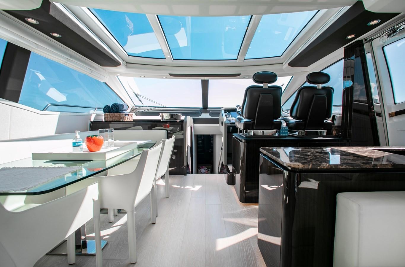 a room with a table and chairs aboard ROLLING LOUD Yacht for Sale