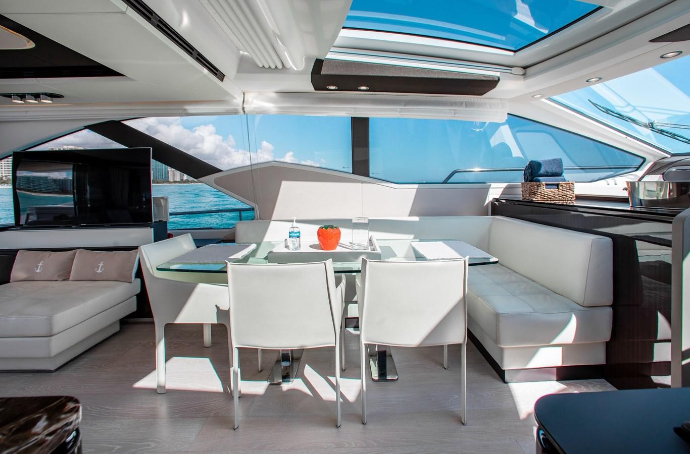 a room with a table and chairs aboard ROLLING LOUD Yacht for Sale