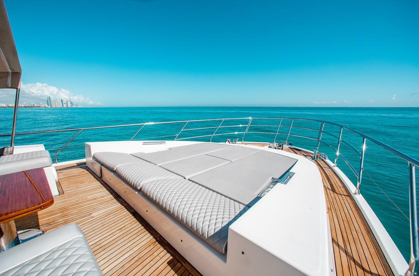 a deck with a pool and a view of the ocean aboard ROLLING LOUD Yacht for Sale