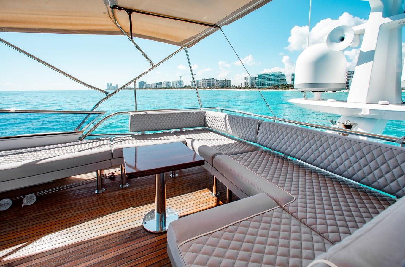 a deck with a view of the ocean and a large ship aboard ROLLING LOUD Yacht for Sale