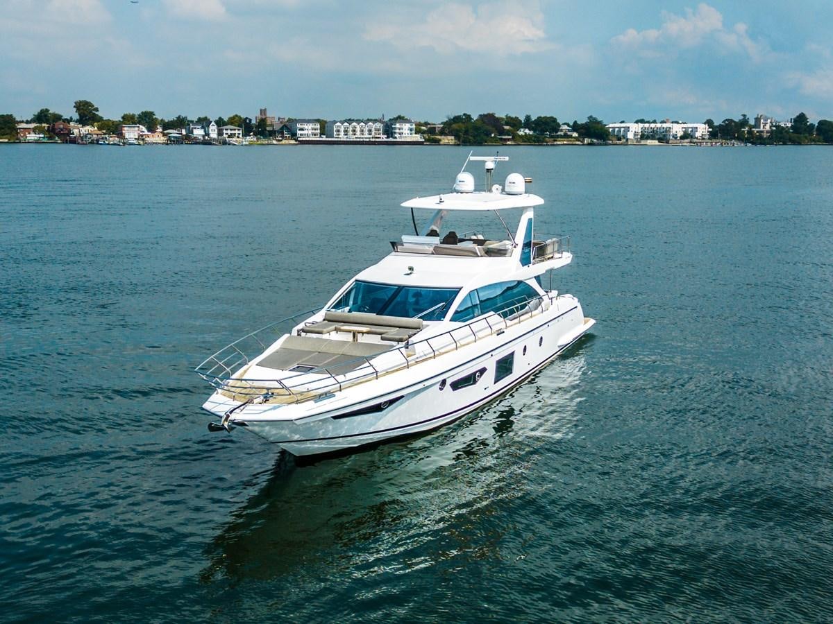 a white boat in the water aboard EVADO Yacht for Sale