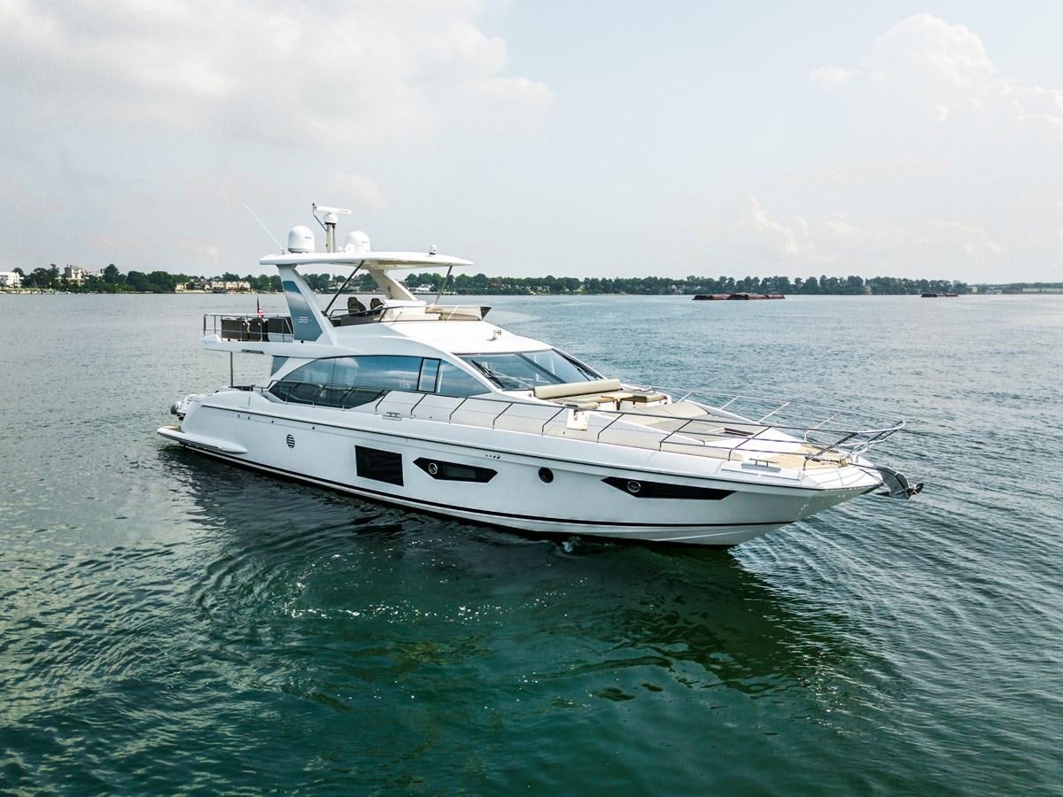 a white yacht in the water aboard EVADO Yacht for Sale