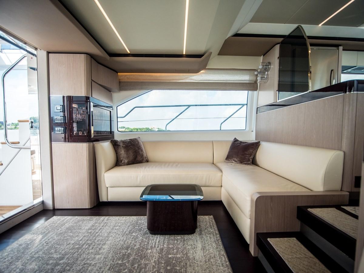 a couch in a room aboard EVADO Yacht for Sale