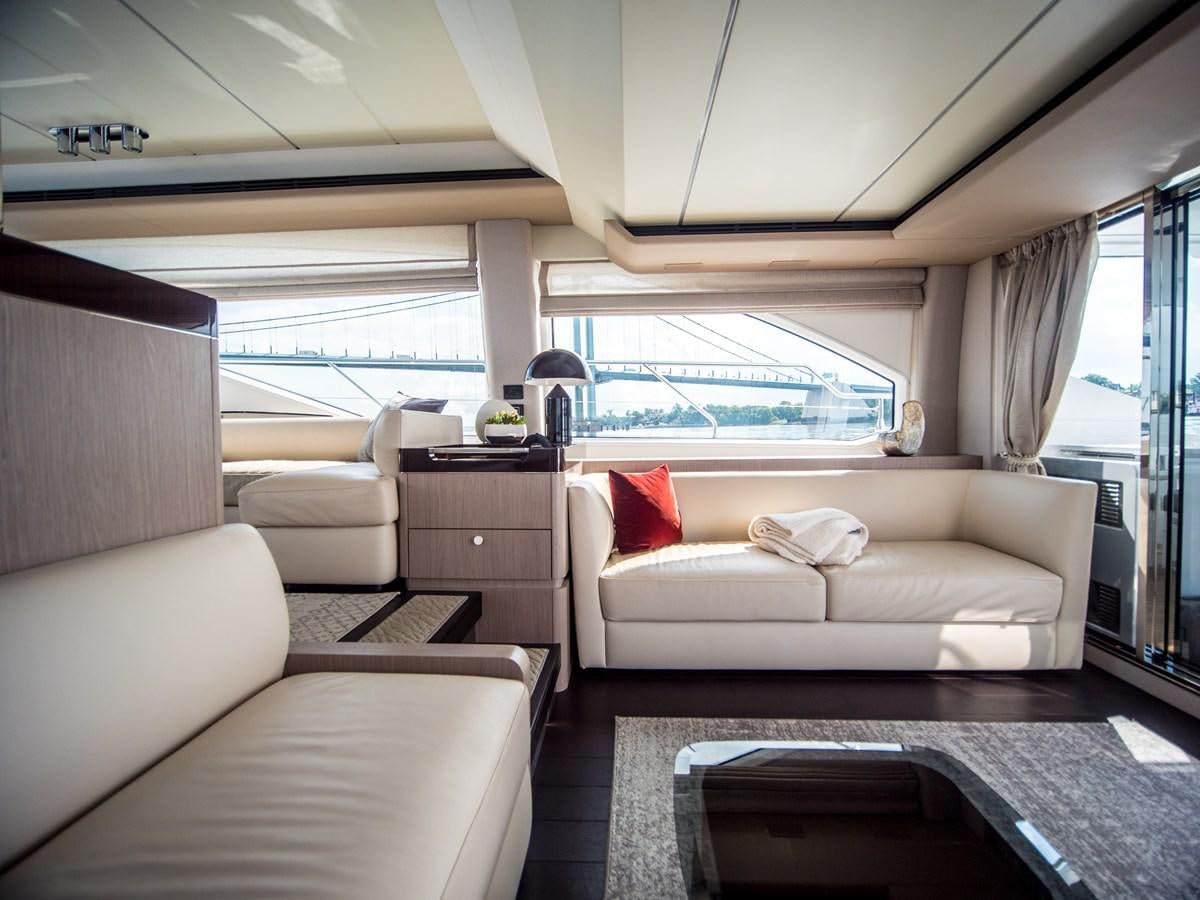 a living room with a large window aboard EVADO Yacht for Sale