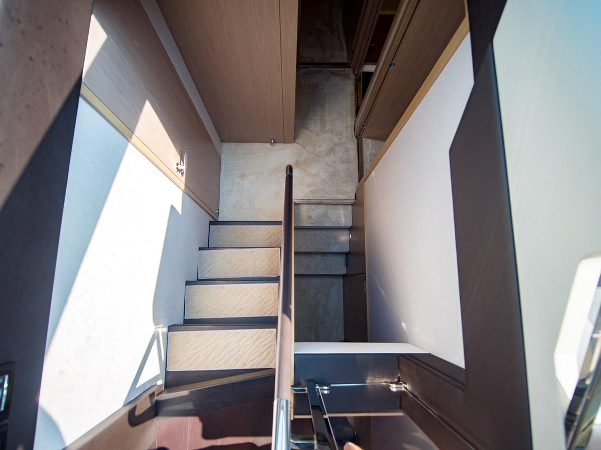 a staircase with a railing aboard EVADO Yacht for Sale