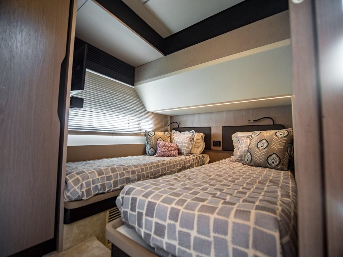 a couple of beds in a room aboard EVADO Yacht for Sale