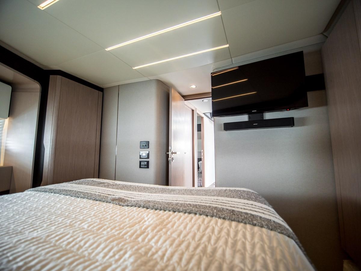 a bed in a room aboard EVADO Yacht for Sale
