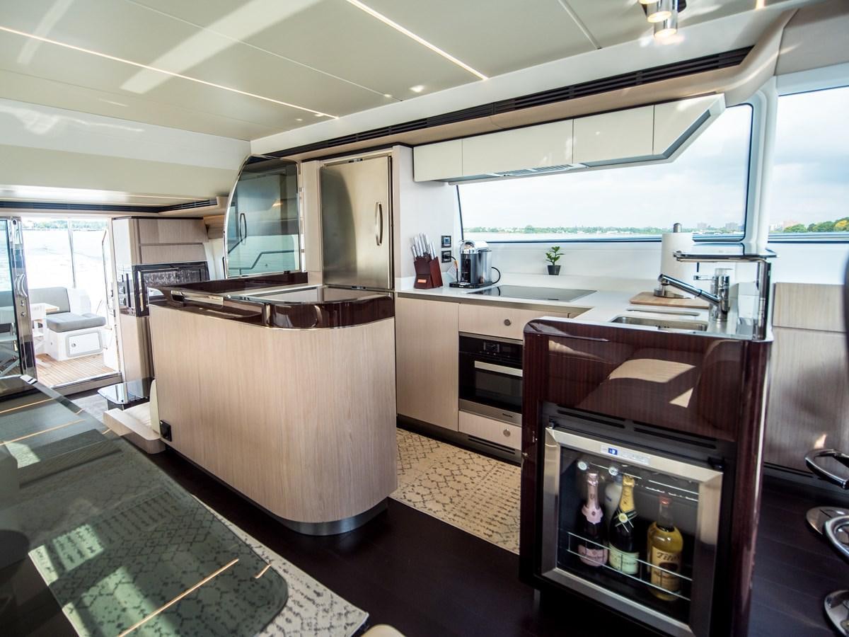 a kitchen with a sink and cabinets aboard EVADO Yacht for Sale