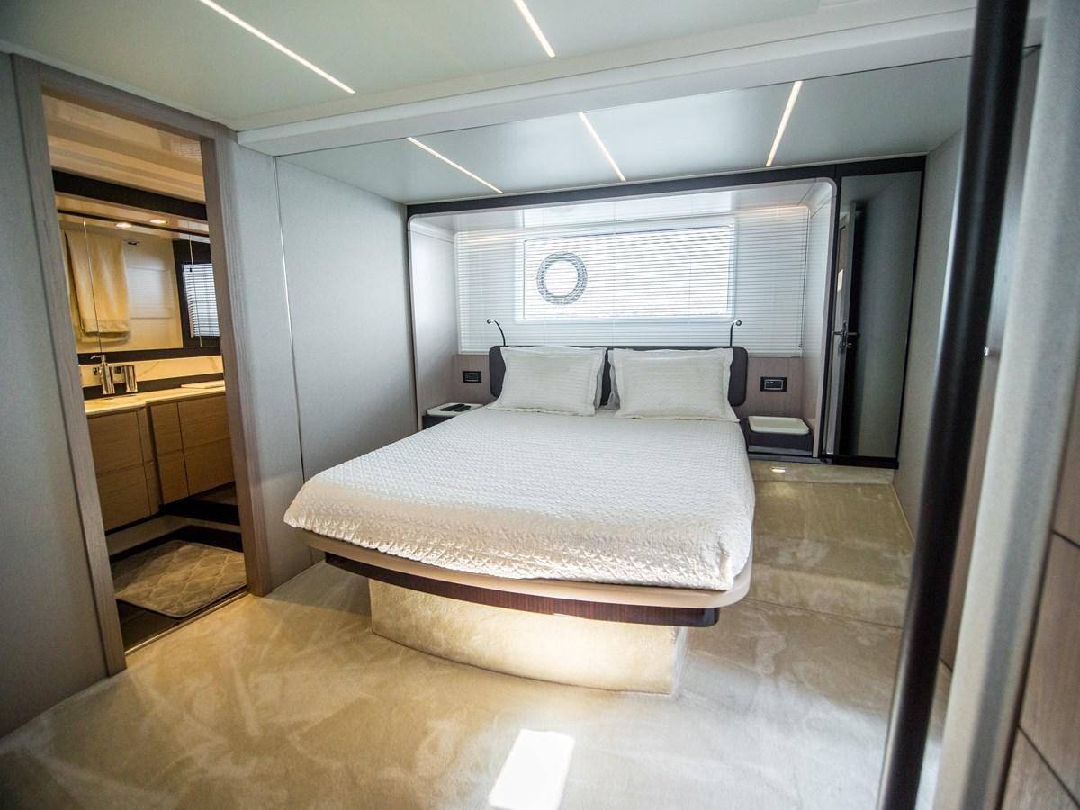 a bed in a room aboard EVADO Yacht for Sale