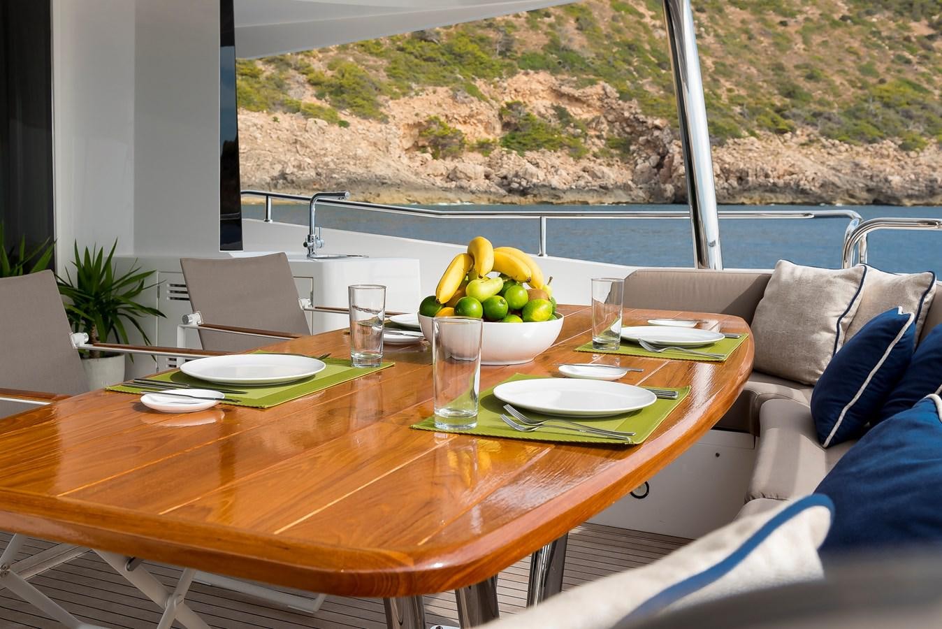 a table with a bowl of fruit on it aboard AFTER 8 II Yacht for Sale
