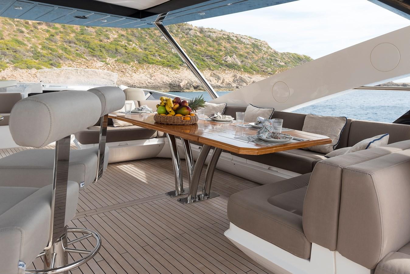 a table with a bowl of fruit on it aboard AFTER 8 II Yacht for Sale