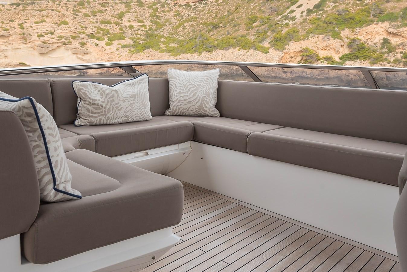 a couch with pillows on it aboard AFTER 8 II Yacht for Sale