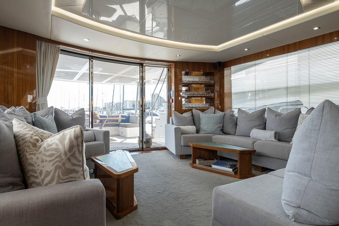 a living room with a large window aboard AFTER 8 II Yacht for Sale