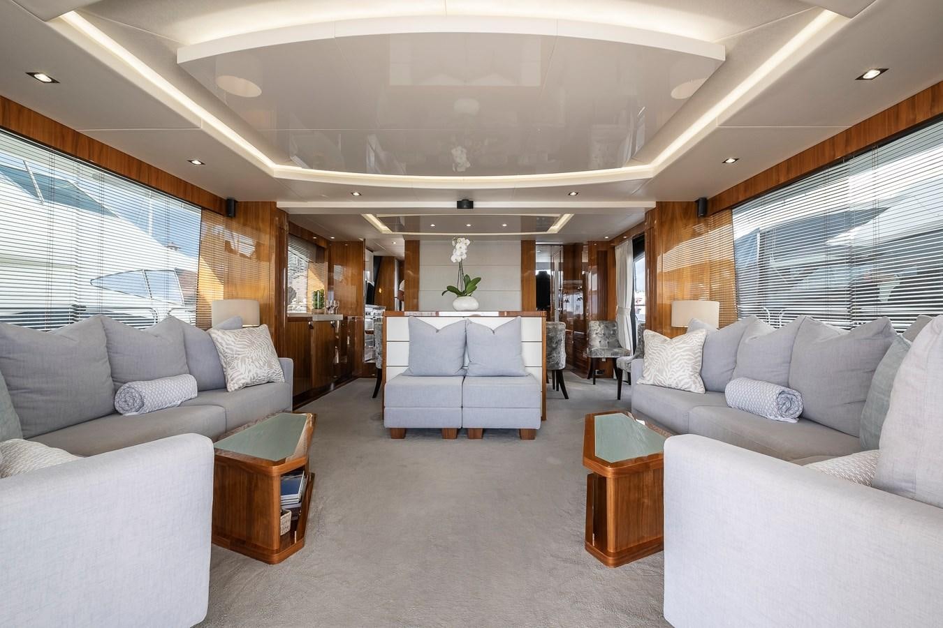 a living room with a large window aboard AFTER 8 II Yacht for Sale