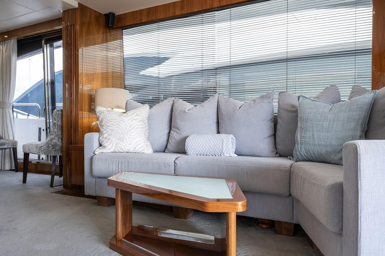 a couch and a table in a room aboard AFTER 8 II Yacht for Sale