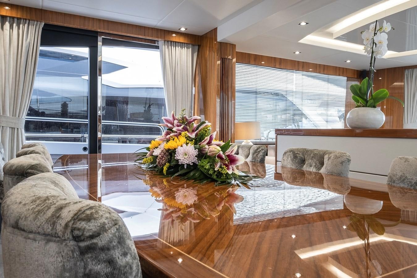 a living room with a large window aboard AFTER 8 II Yacht for Sale