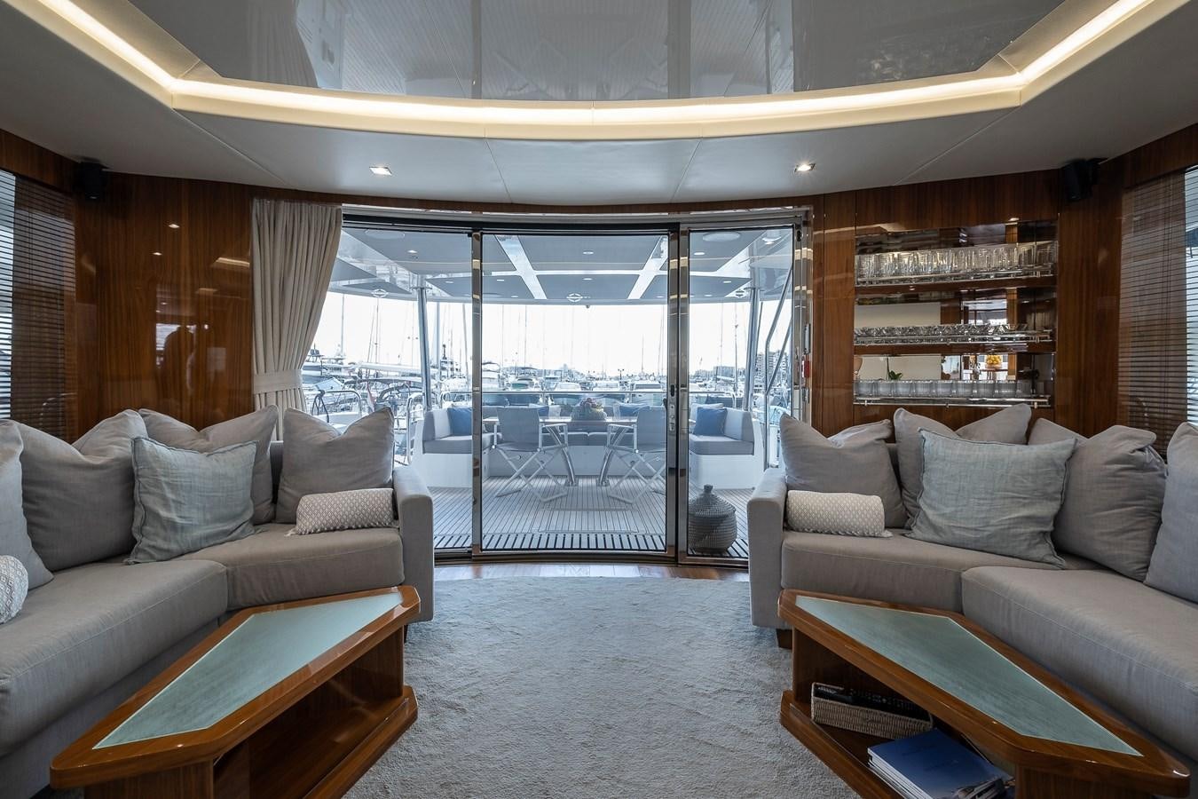 a living room with a large glass door aboard AFTER 8 II Yacht for Sale