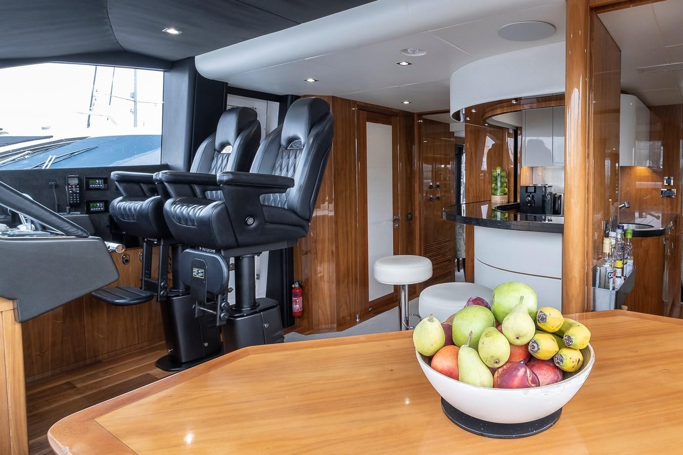 a bowl of apples on a table aboard AFTER 8 II Yacht for Sale
