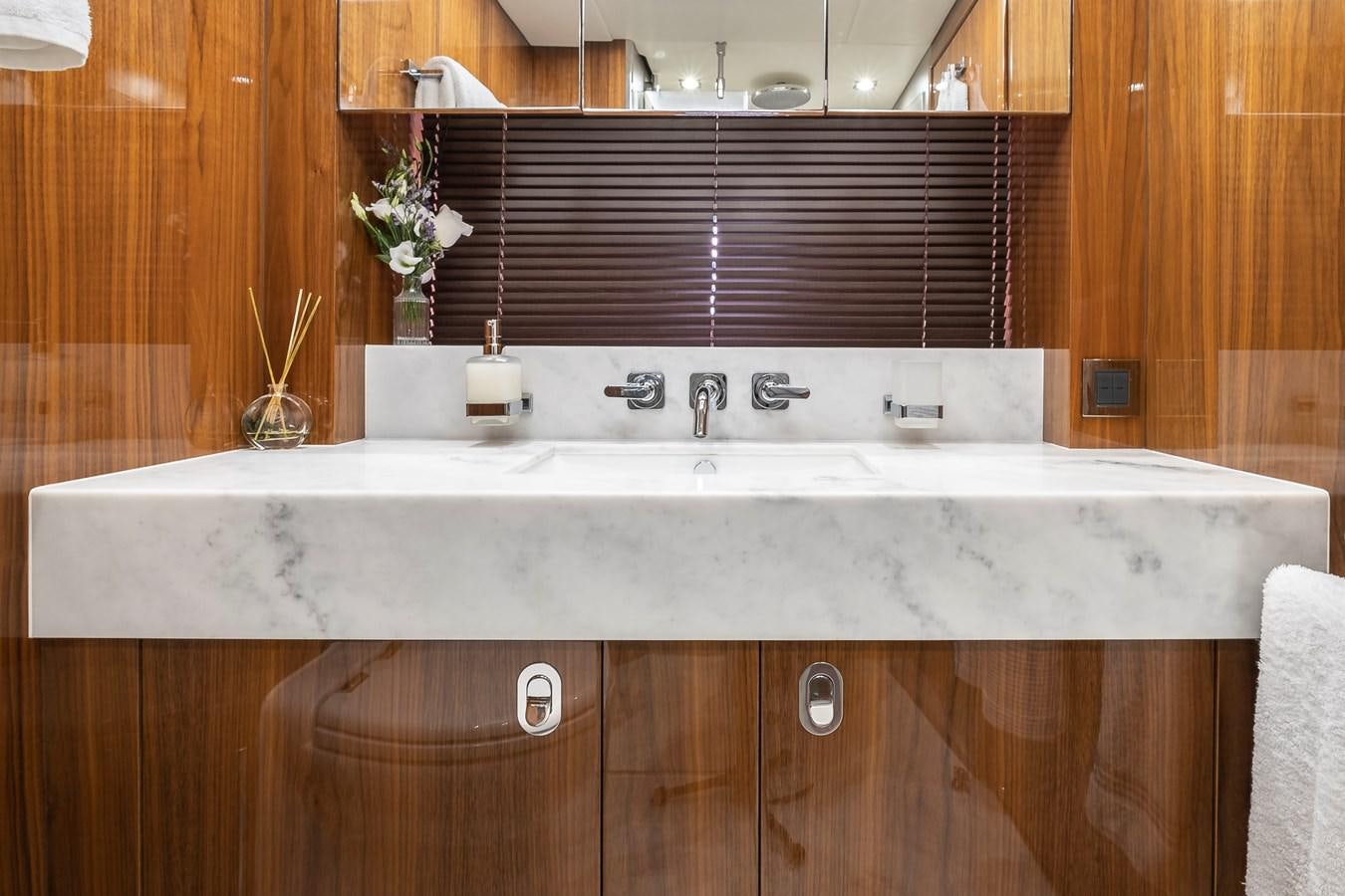 a kitchen sink with a black counter aboard AFTER 8 II Yacht for Sale