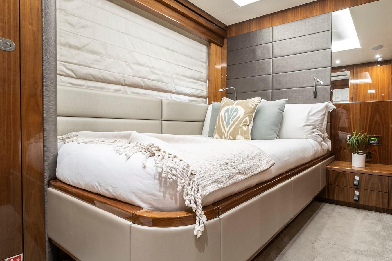 a bed with white sheets aboard AFTER 8 II Yacht for Sale