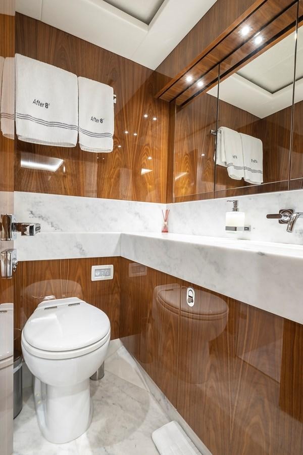 a bathroom with a toilet and a sink aboard AFTER 8 II Yacht for Sale