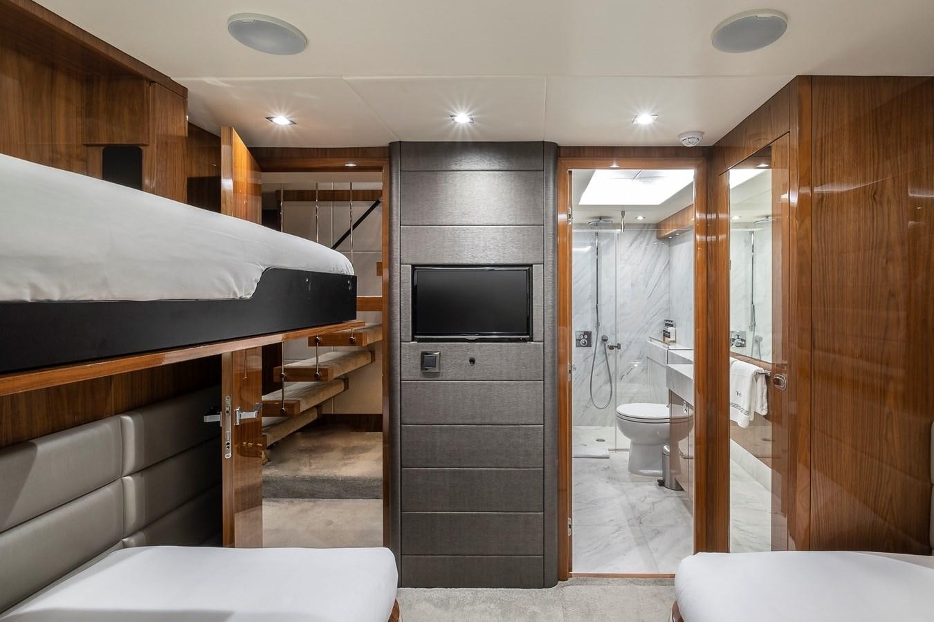 a room with a bed and a television aboard AFTER 8 II Yacht for Sale