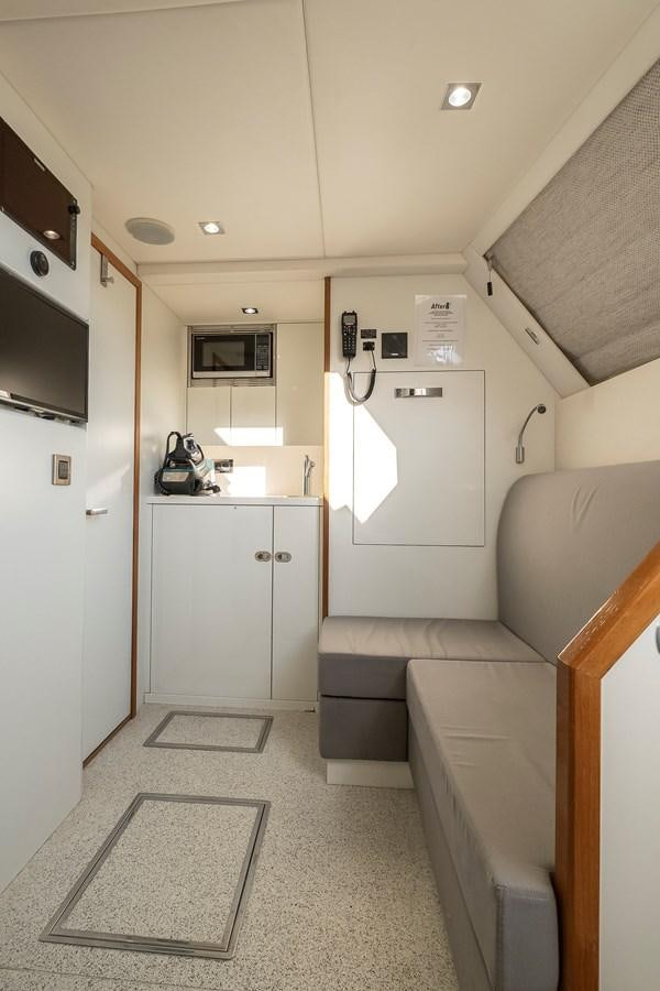 a kitchen with a staircase aboard AFTER 8 II Yacht for Sale