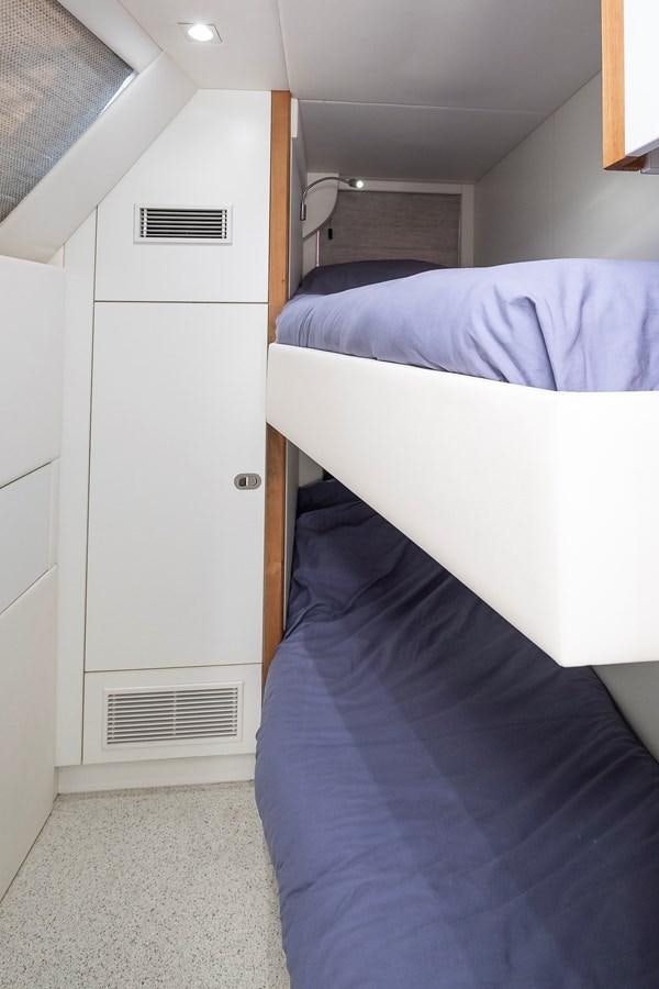 a room with a bed and a closet aboard AFTER 8 II Yacht for Sale