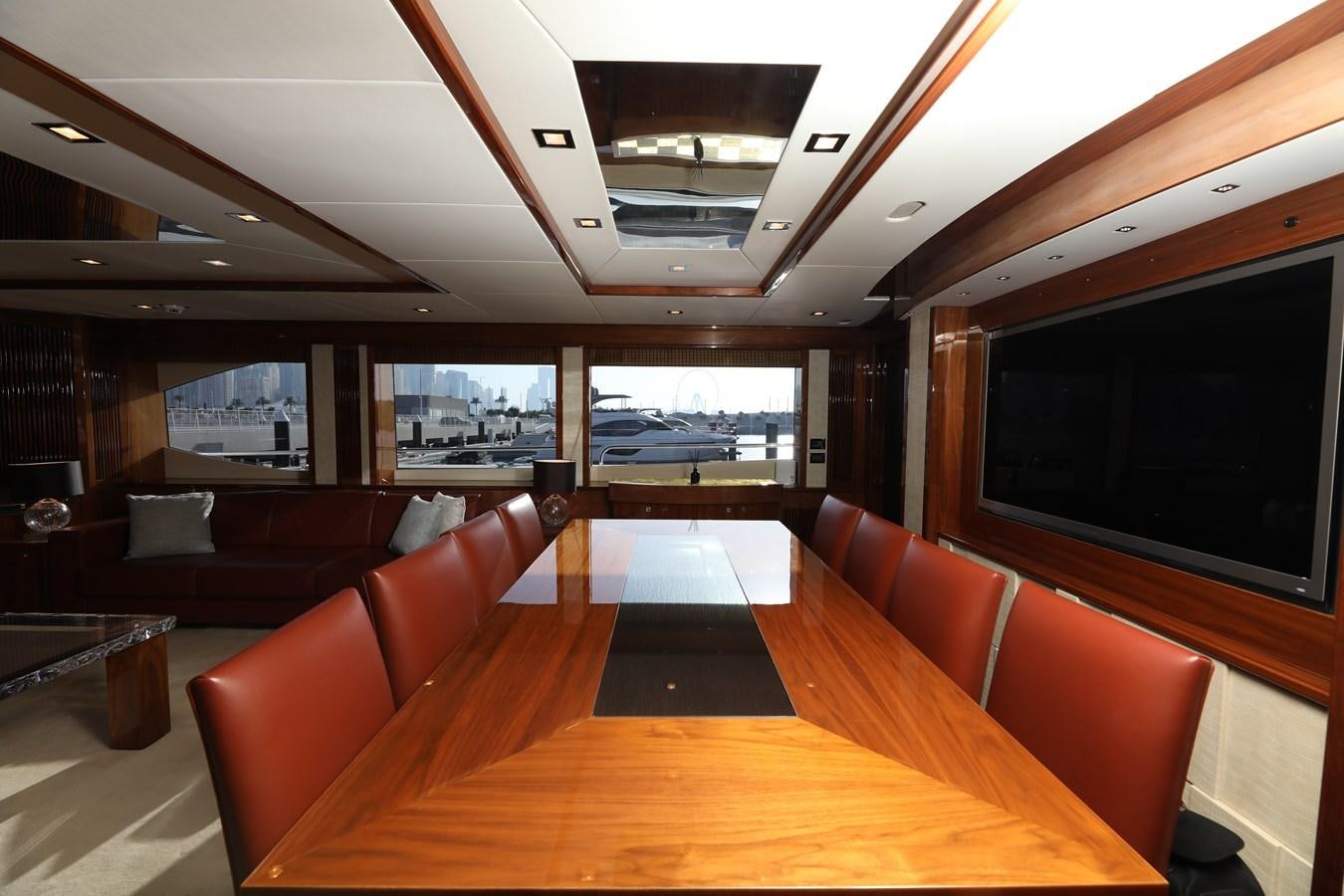 a room with a tv and couches aboard SUNSEEKER 30M Yacht for Sale