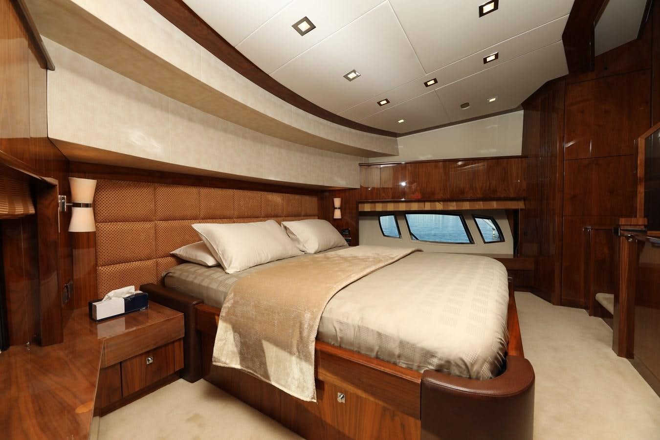 a room with a bed and a window aboard SUNSEEKER 30M Yacht for Sale