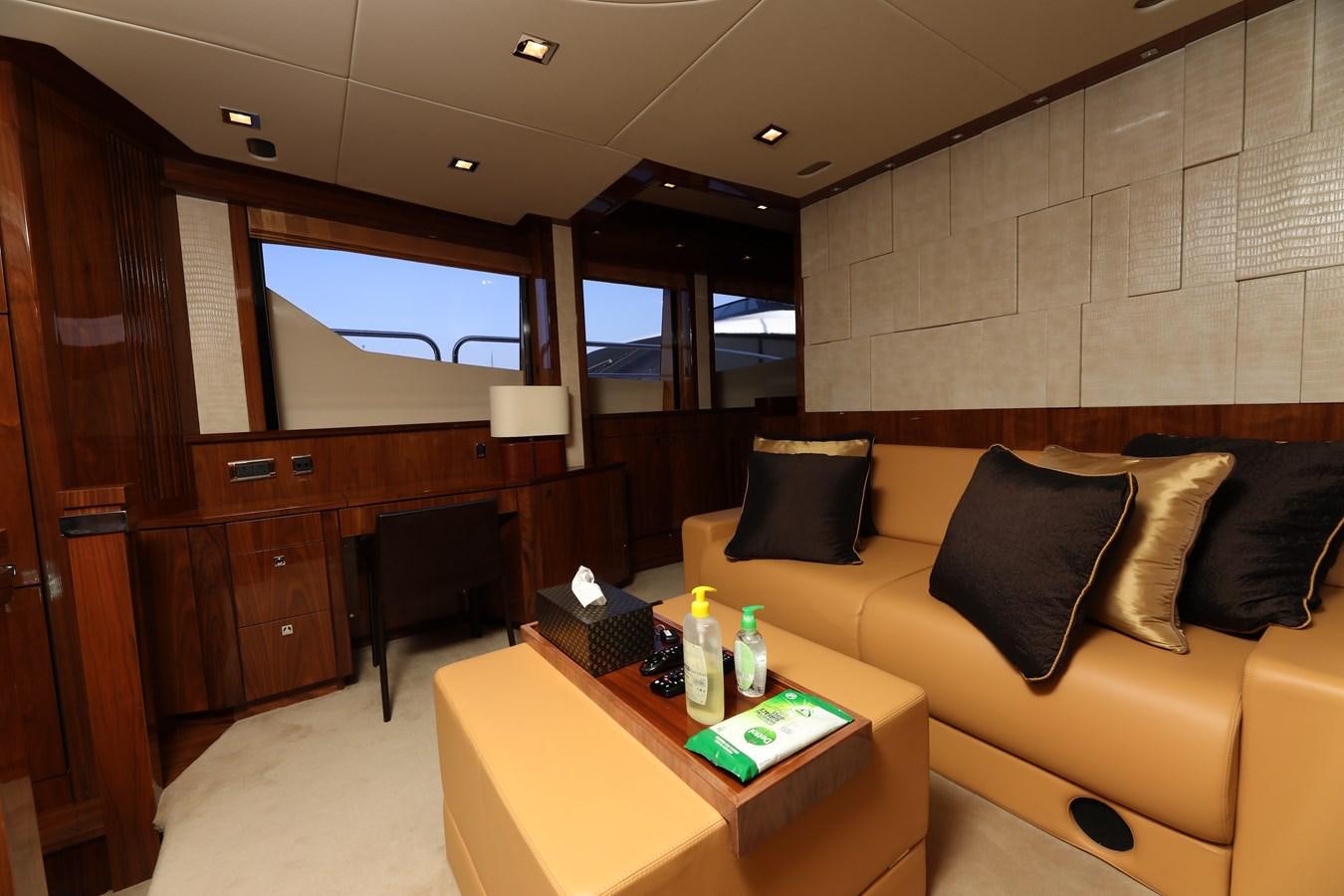 a living room with a couch and a coffee table aboard SUNSEEKER 30M Yacht for Sale