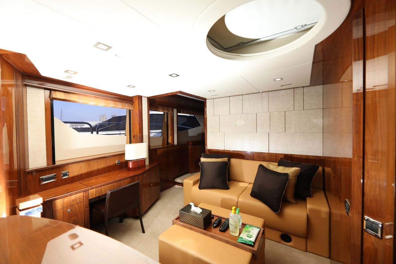 a room with a couch and a tv aboard SUNSEEKER 30M Yacht for Sale