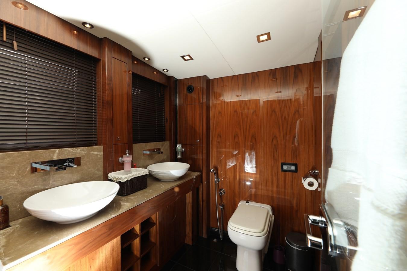 a bathroom with a sink toilet and a bathtub aboard SUNSEEKER 30M Yacht for Sale