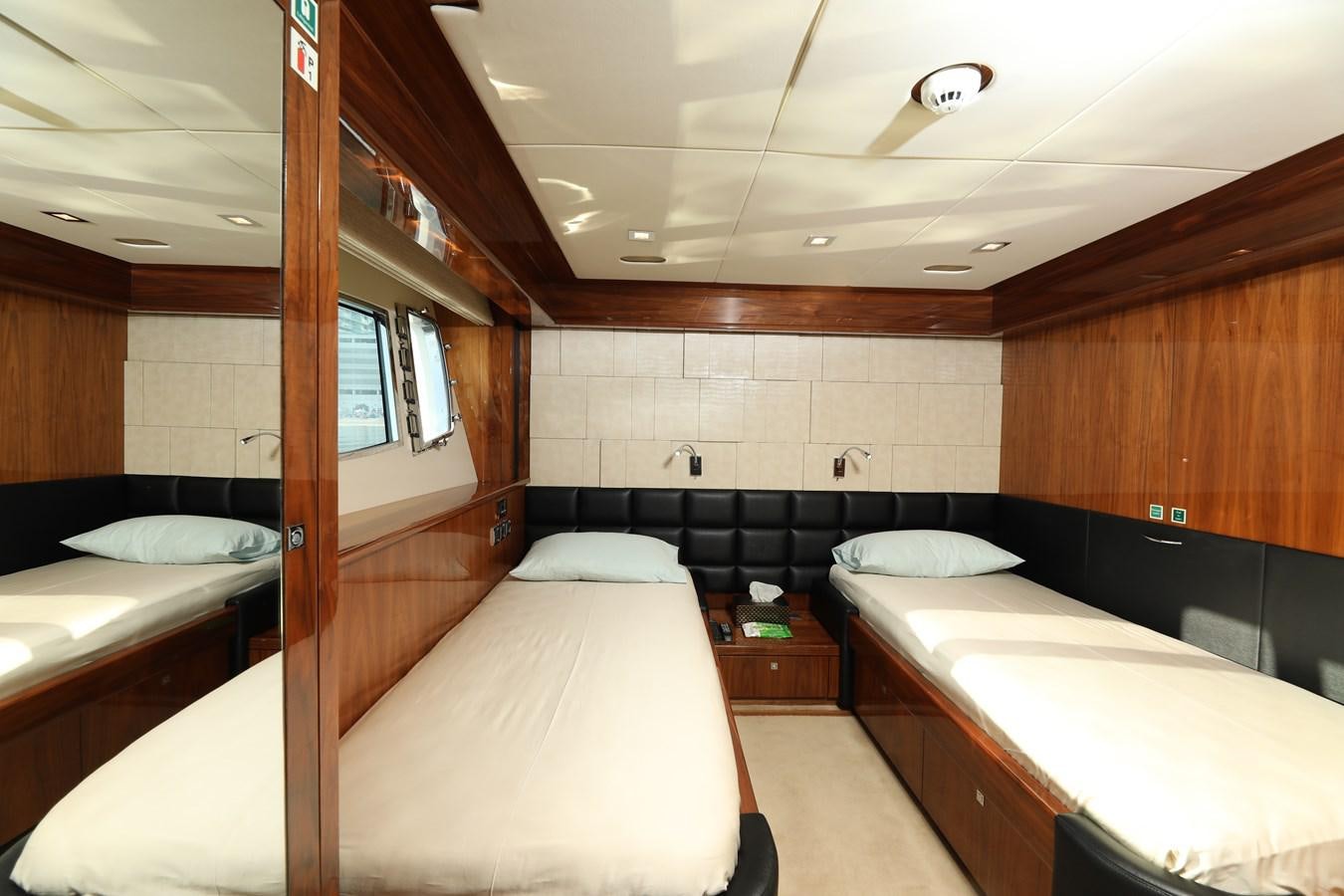 a room with a bed and a window aboard SUNSEEKER 30M Yacht for Sale