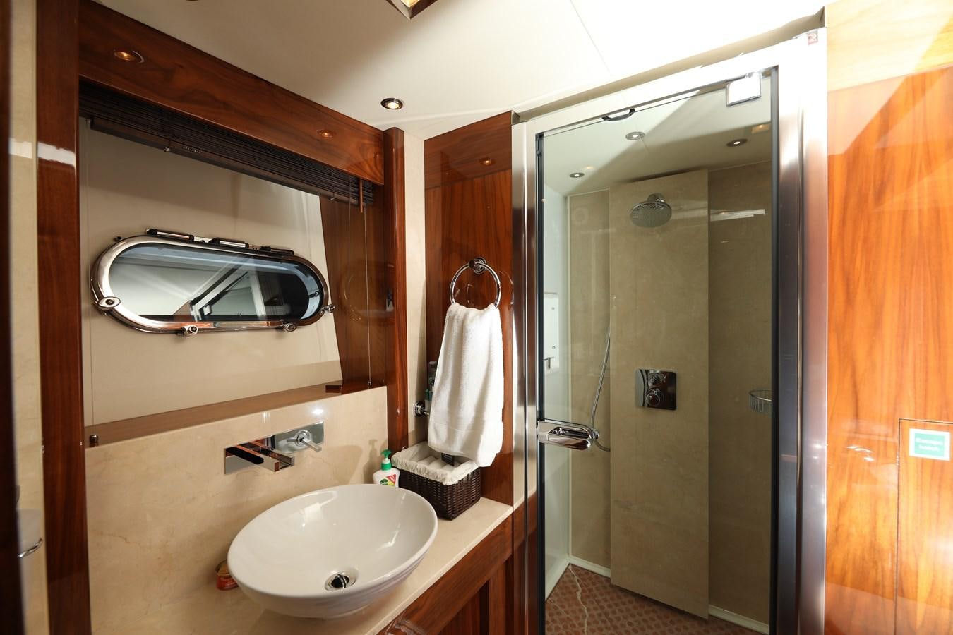 a bathroom with a sink and a mirror aboard SUNSEEKER 30M Yacht for Sale