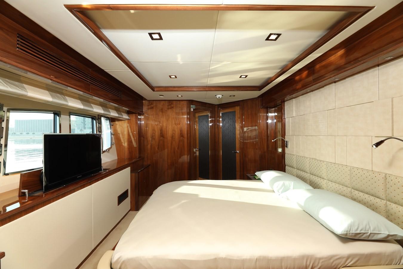 a room with a bed and a tv aboard SUNSEEKER 30M Yacht for Sale