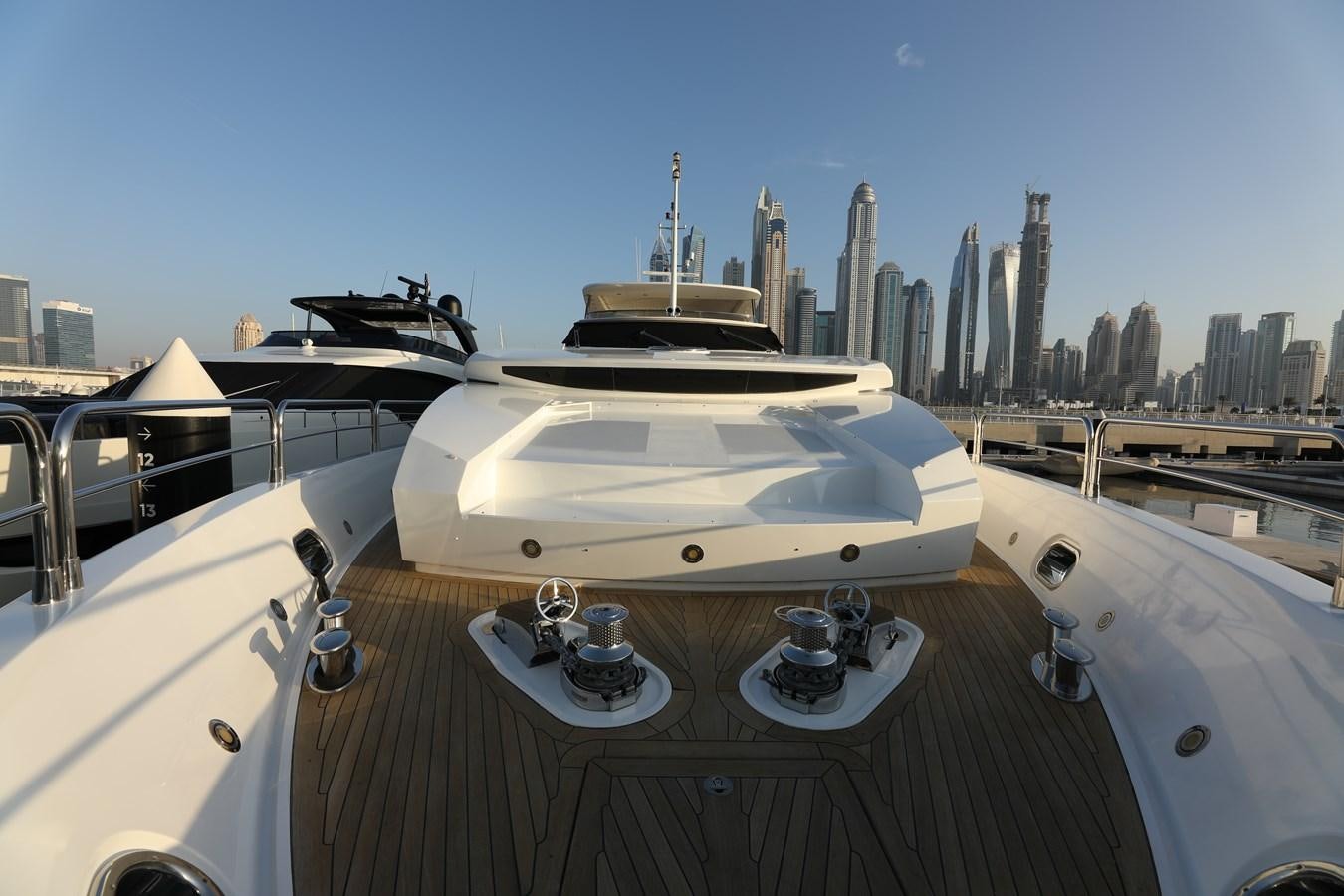 a white yacht on a deck aboard SUNSEEKER 30M Yacht for Sale