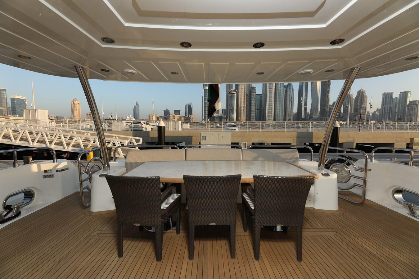 a table with chairs around it aboard SUNSEEKER 30M Yacht for Sale